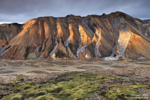 Rays of sun light up the ridges of Austurbarmur near Landmannalaugar.