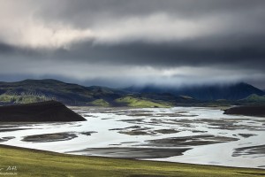 Dark skies over glacier river flood plains.